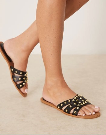 studded flat sandals in black